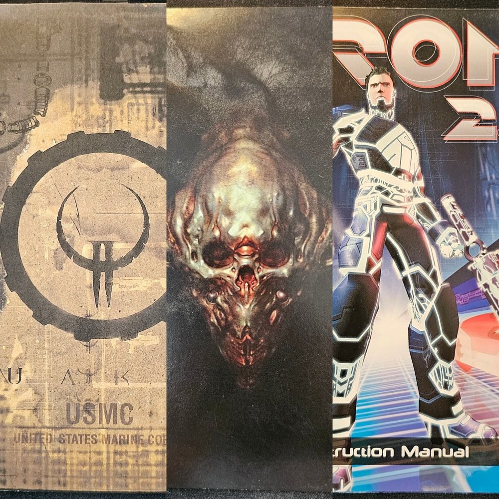 3 collectible classic PC game manuals (1997-2004): DOOM 3, QUAKE II, Tron 2.0